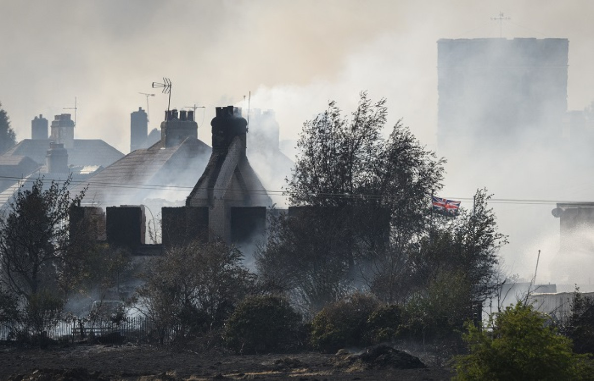 Wildfires rage across Britain amid record temperature