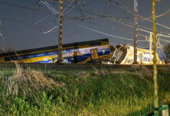 Dutch rail crash: One dead after passenger train hits crane and derails