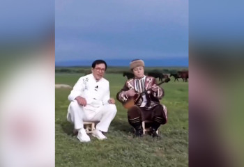 Jackie Chan plays dombra