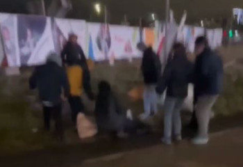 В Астане из-за сильного ветра на женщину упал забор