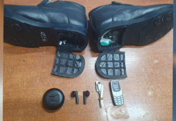 Тергеу изоляторына аяқ киіміне телефон жасырып кірмек болған азамат ұсталды