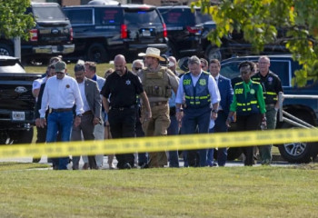 Boy, 14, arrested after four killed in Georgia school shooting